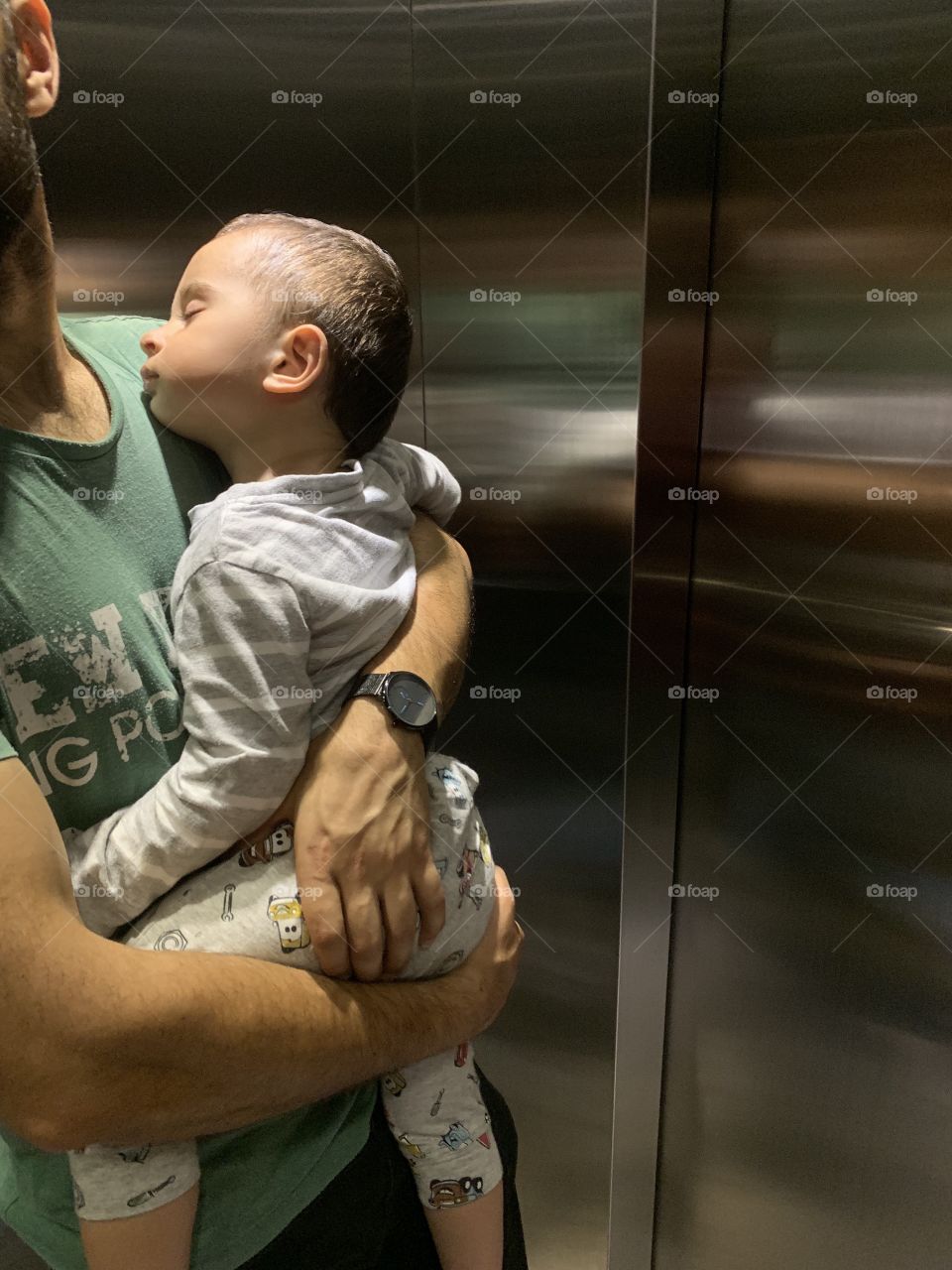 Sleeping baby on dad