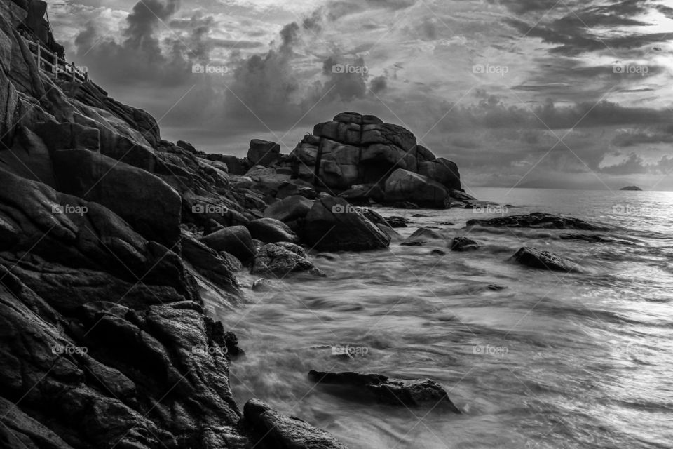 Dramatic Sunrise at the coastline of Long Chao Kok Trail, moody skies with a seascapes drama..