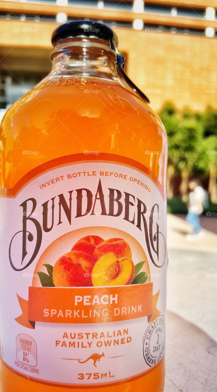 Bundaberg branded sparkling soft drink with peach flavoring. Bundaberg is an Australian-owned company.