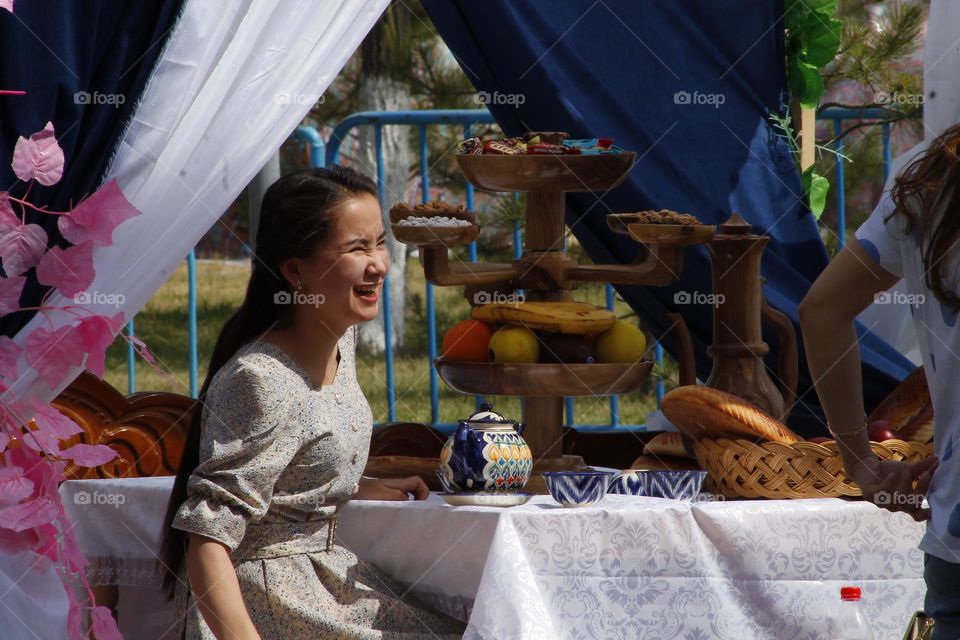 The girl laughs an interesting face