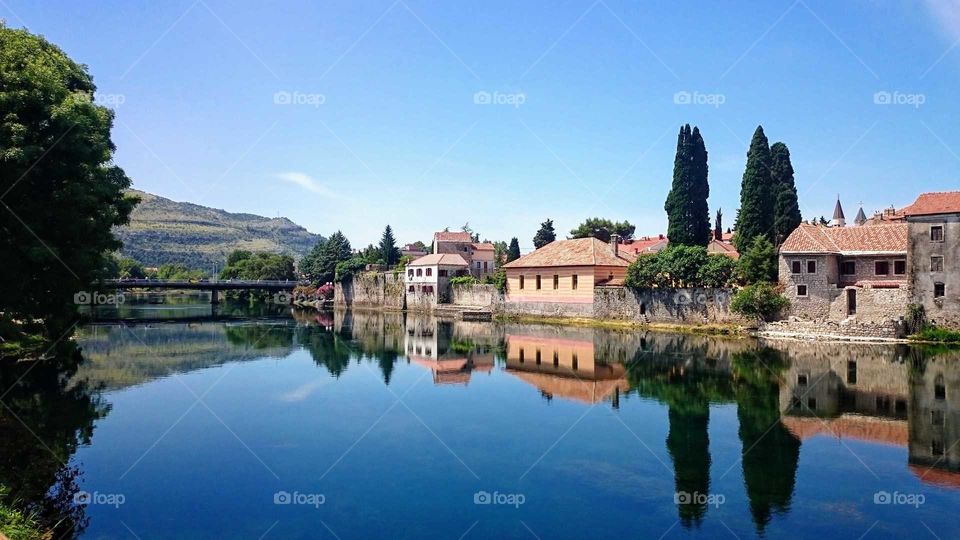 A beautiful riverside view from Trebinje in Bosnia-Hertzegovina with a reflection