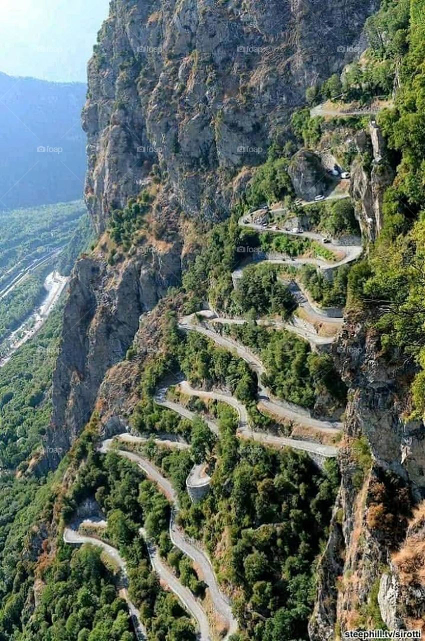 A stunning view of green mountains covered in fog in Yemen