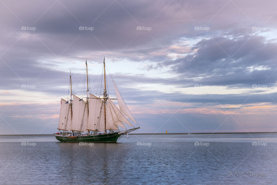 Sailboat in Milwaukee, WI on Lake Michigan at sunset