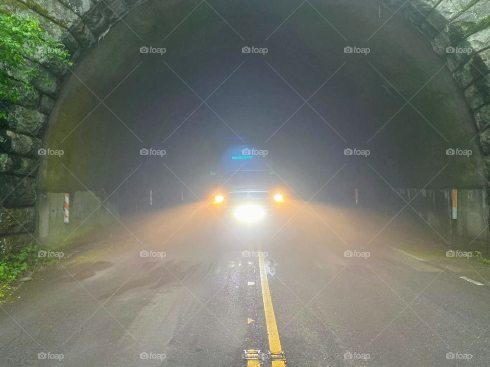 truck in foggy tunnel