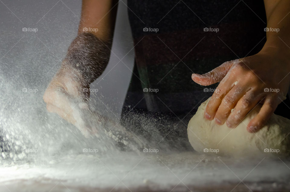 Preparing natural leaven bread.