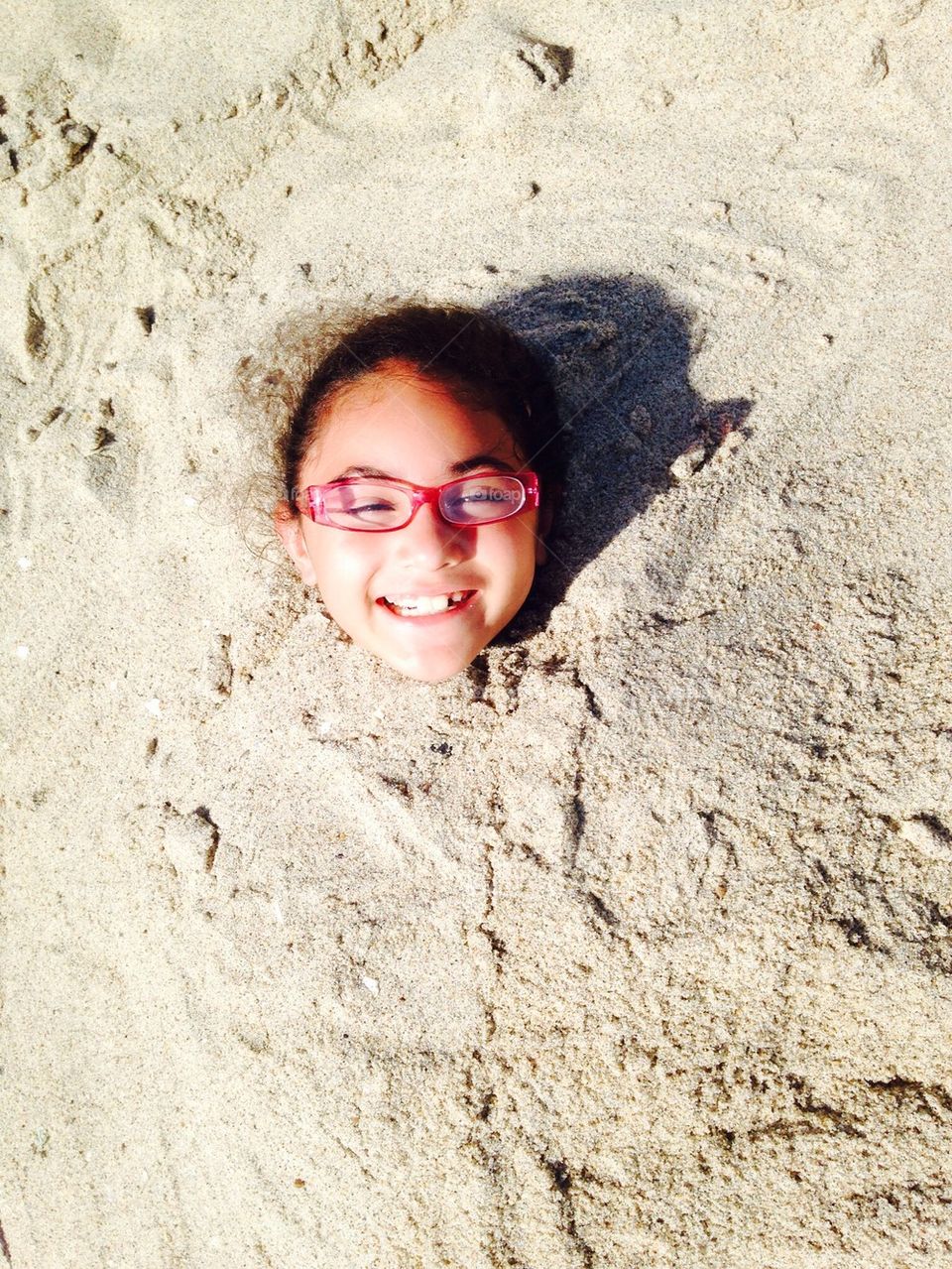 Daughter in sand