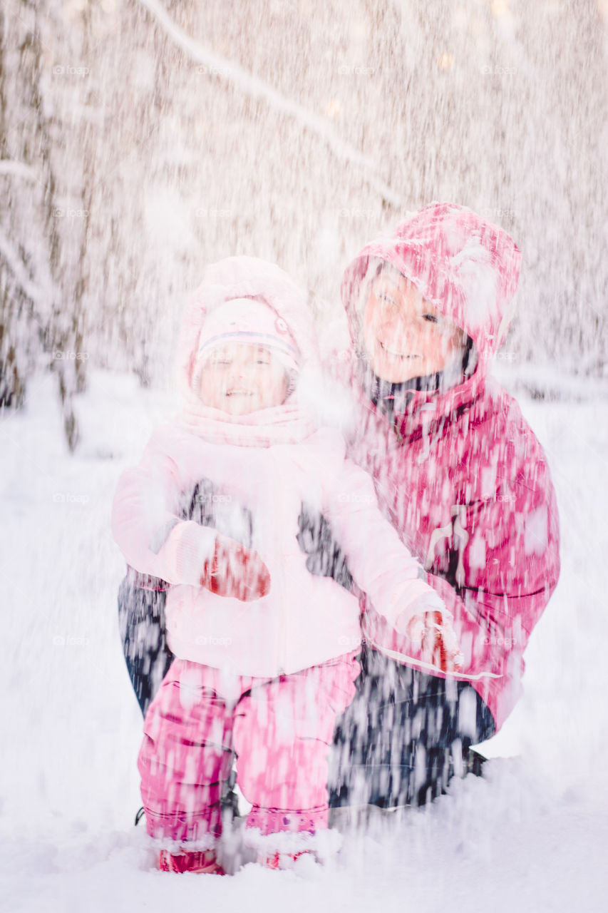 Winter with friends. Spending wintertime outdoors playing with snow