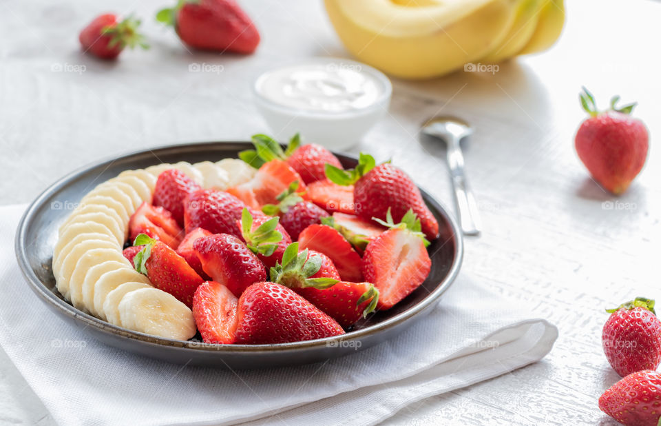 Strawberries and bananas salad.