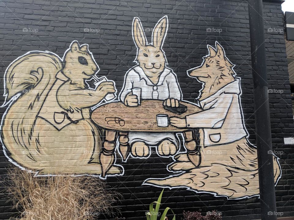 Mural with Rabbit, Fox and Squirrel having coffee on the side of a coffee shop in Louisville, KY