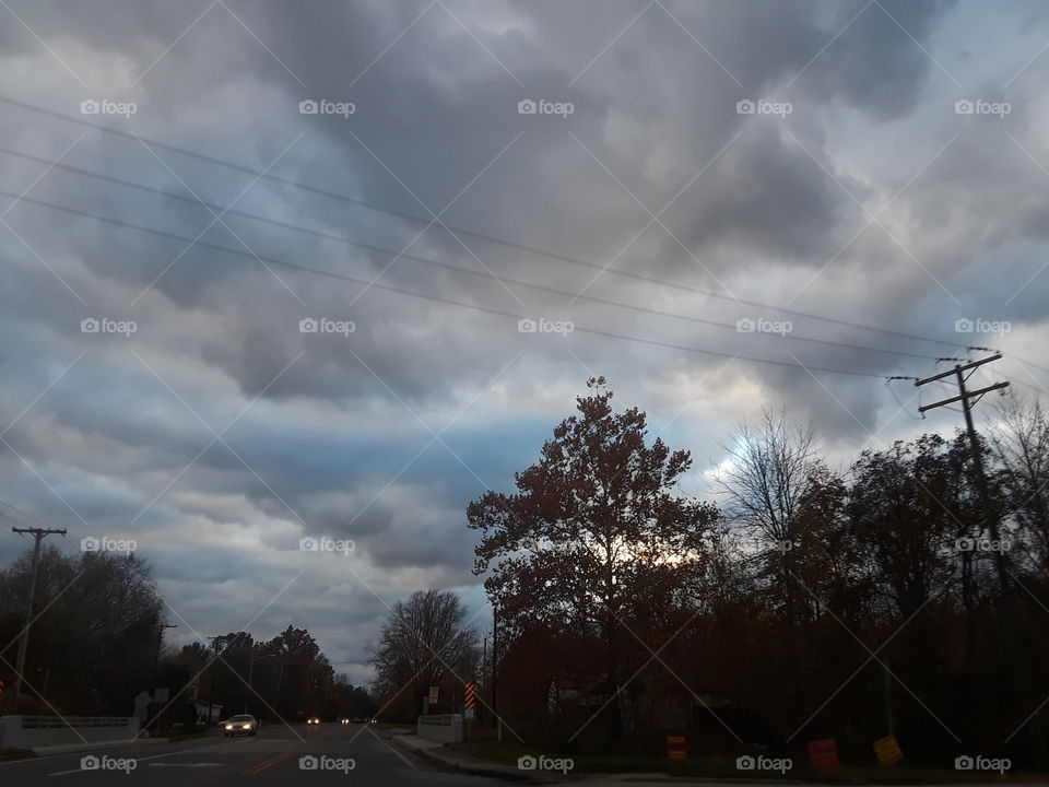 storm clouds sun tree