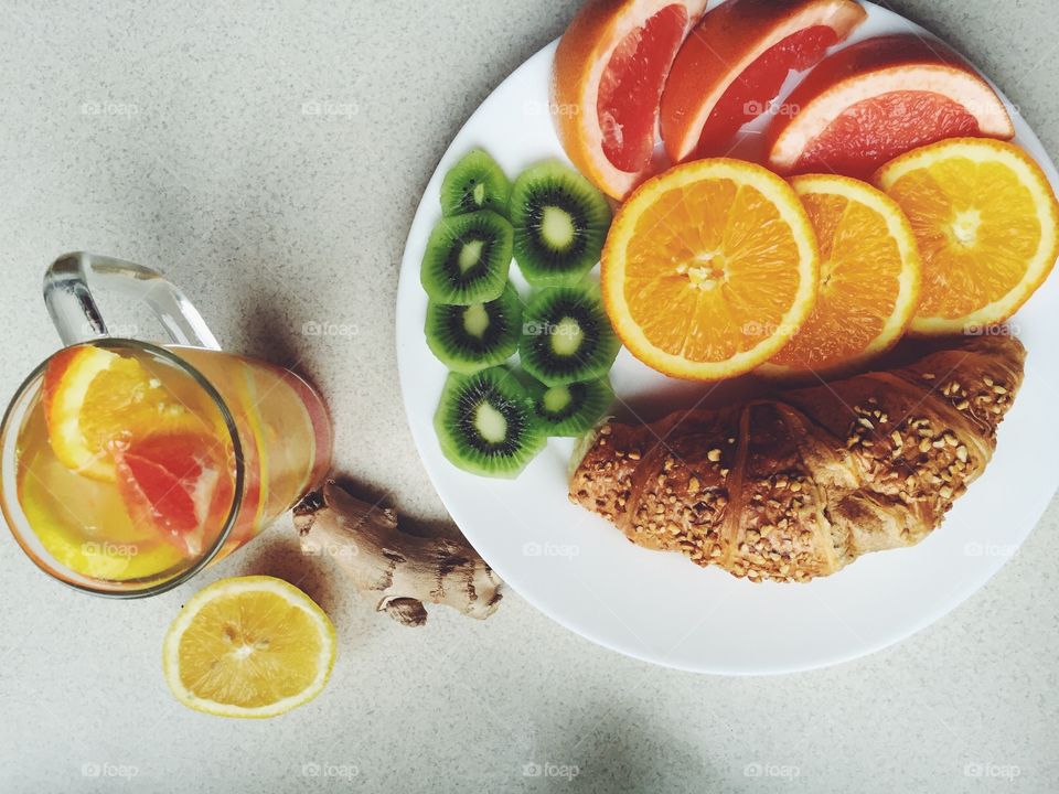 High angle view of croissant and fruits