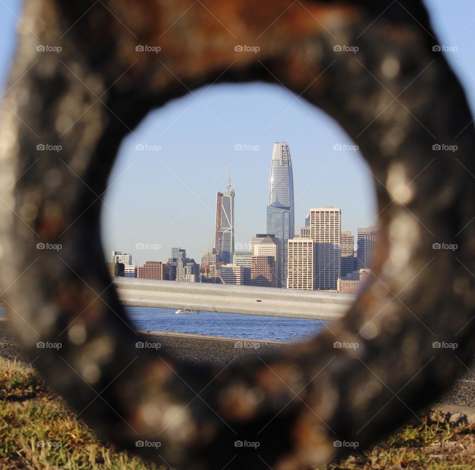 admiring the city through a round shaped ring