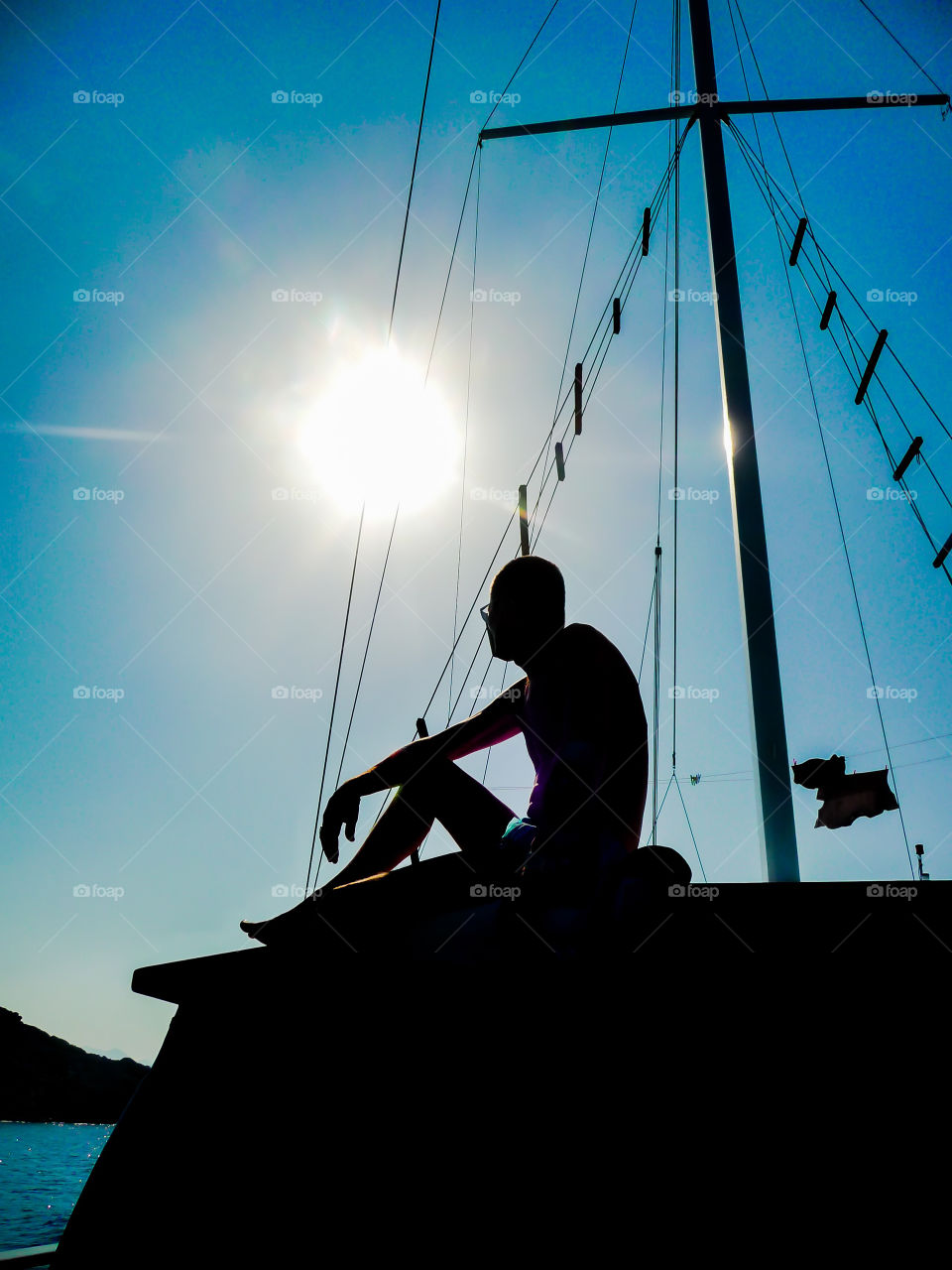 A Silhouette Of My Uncle Looking Out To Sea From A Boat...x