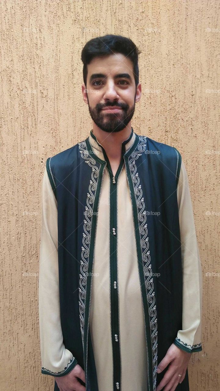 A handsome man wearing traditional moroccan clothes