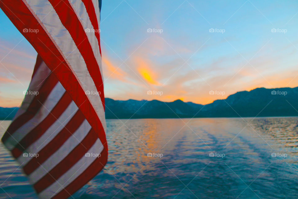 American flag in front of sea