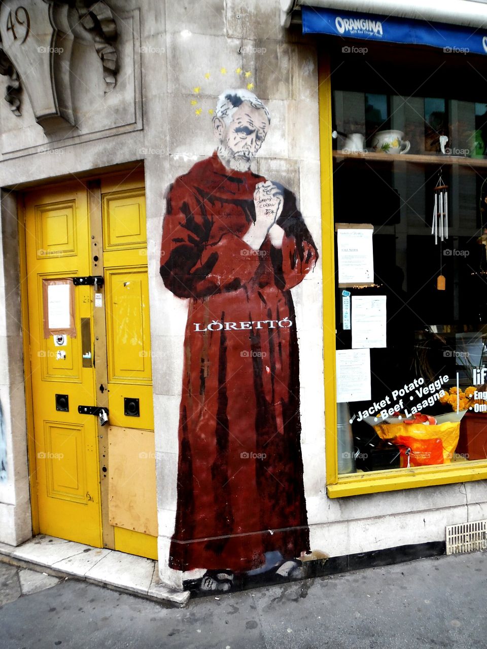 monk poster on a wall in London, it's the face of  J C Jeremy Corbyn