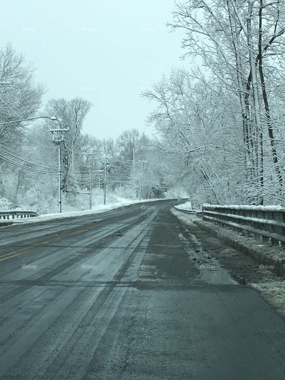 A snowy road in the winter