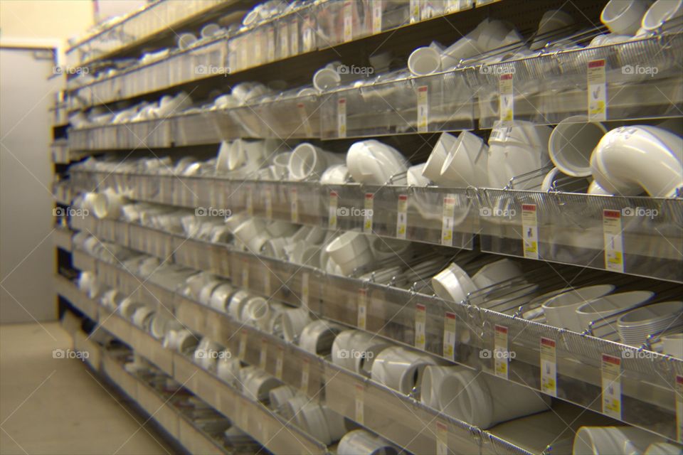 Bins of Large Plastic PVC Pipes & Elbows