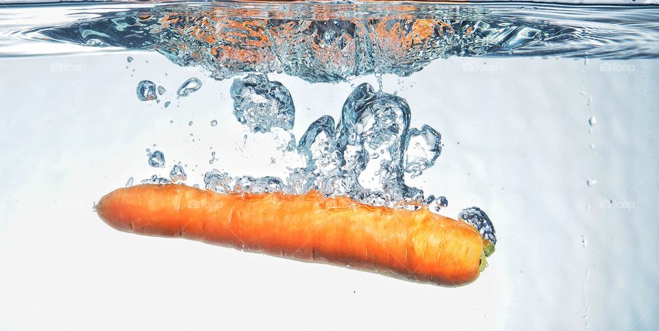 Carrot underwater splash