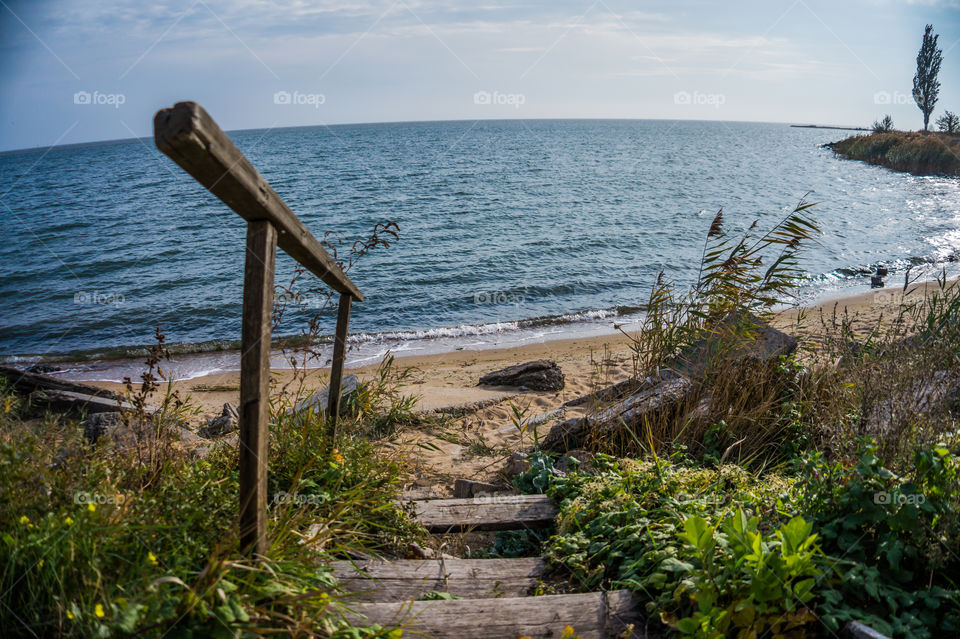 Descent to the seaside along the old wooden stairs