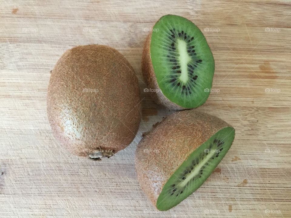 Kiwi fruit on bamboo board 