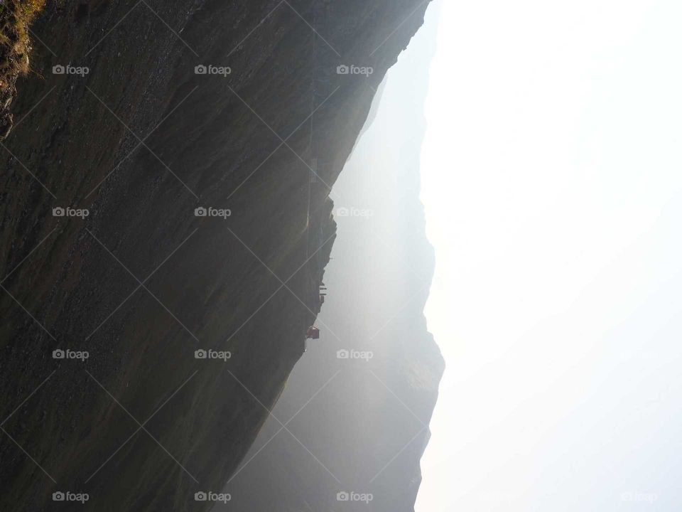 Bright, dusty light during the sunrise in the mountains.