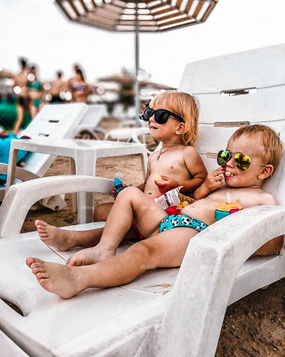 children relax on the beach