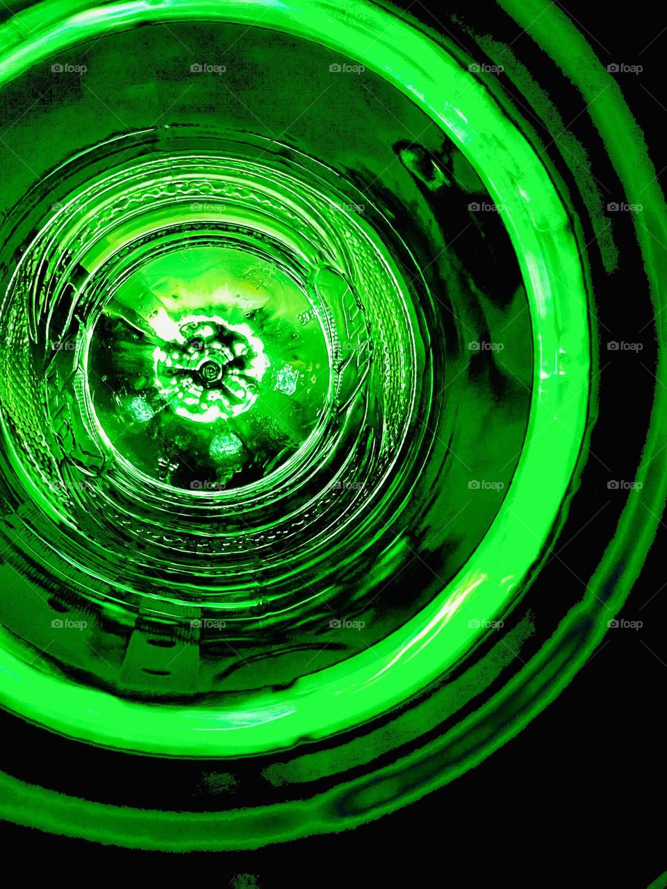 Looking into the light through a green bottle.