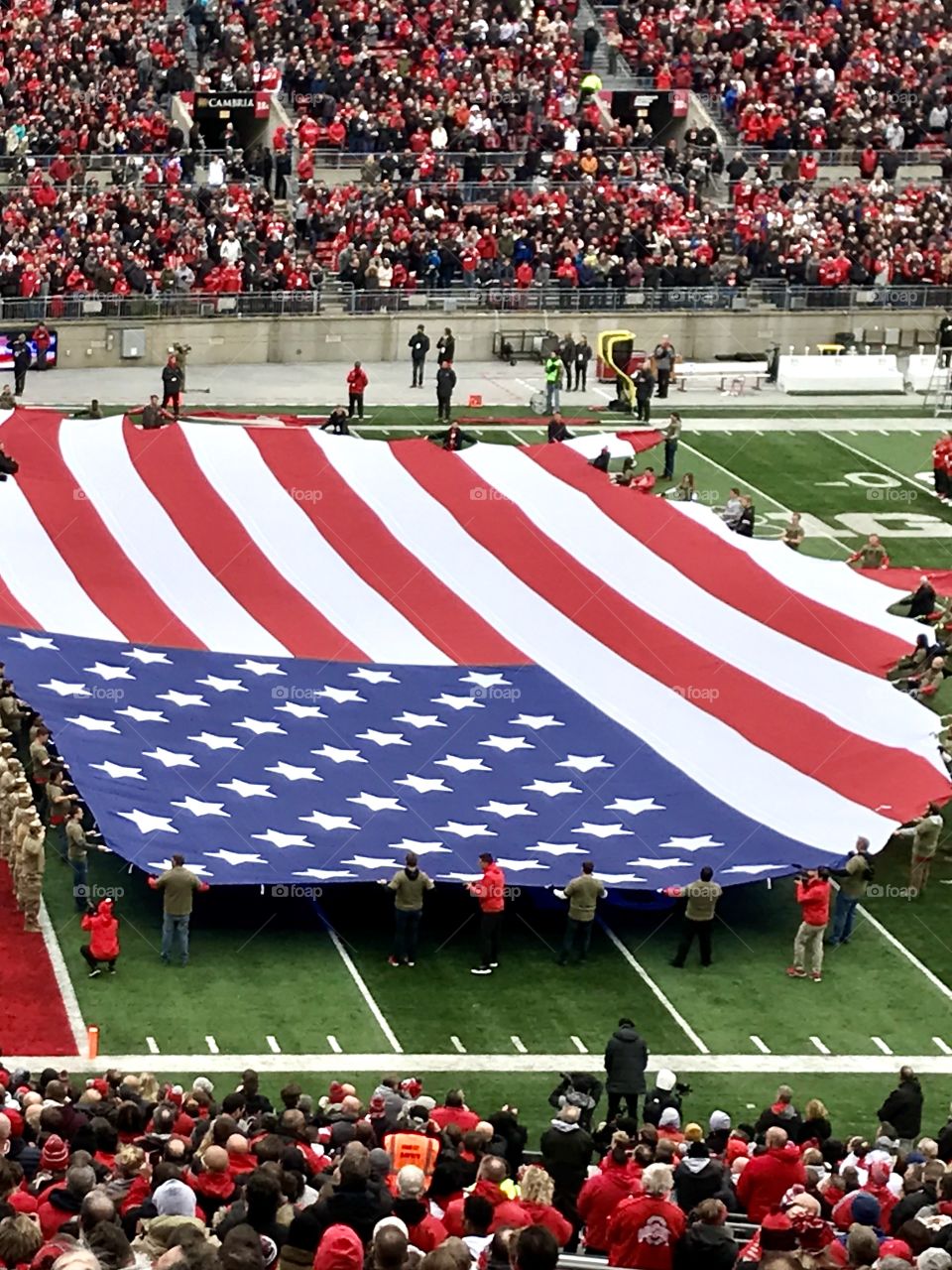 Giant American Flag on a football field 