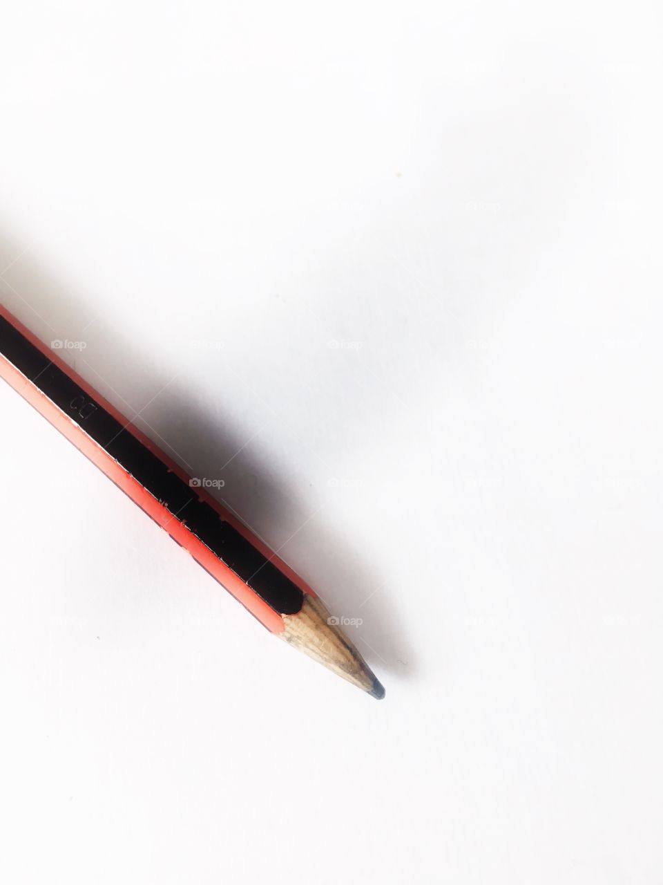 Single graphite pencil on white background 