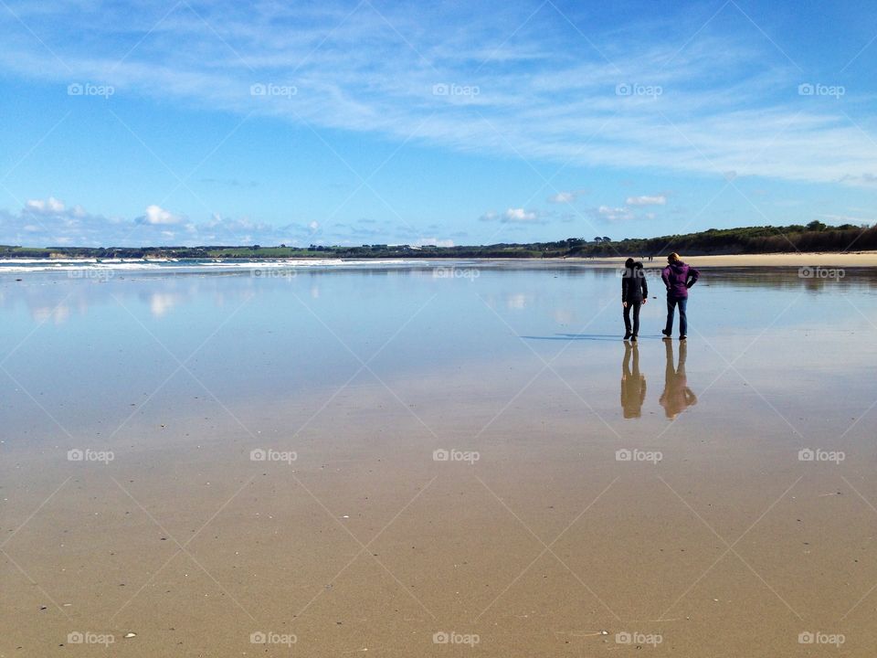 Walking along the beach at low tide 