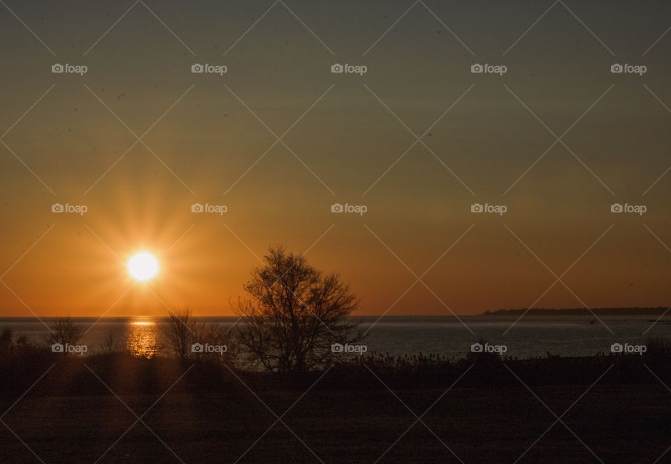 Sunset by the water