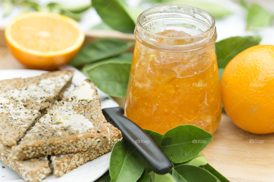 Close-up of marmalade with buttered toast