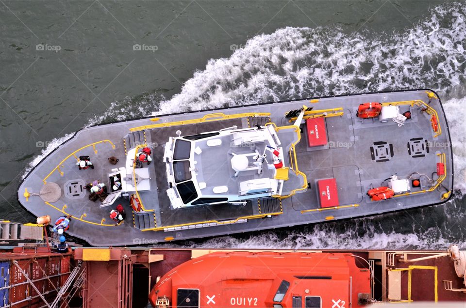 Pilot boat alongside of container vessel