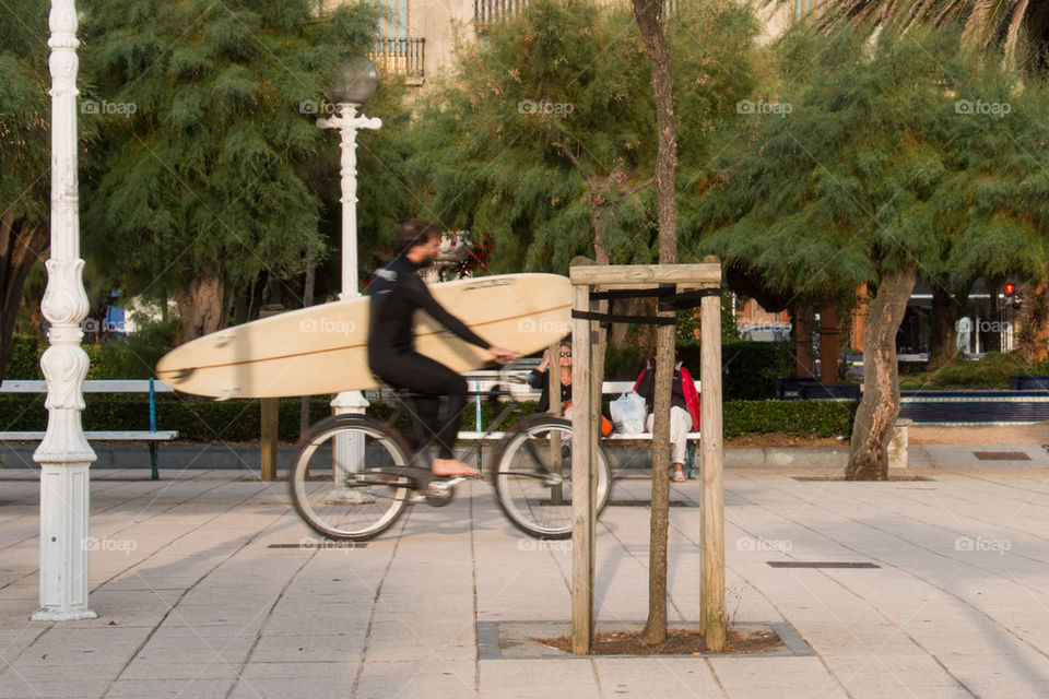 Biking with a board 