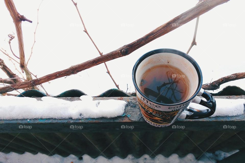 A cup of hot tea in winter