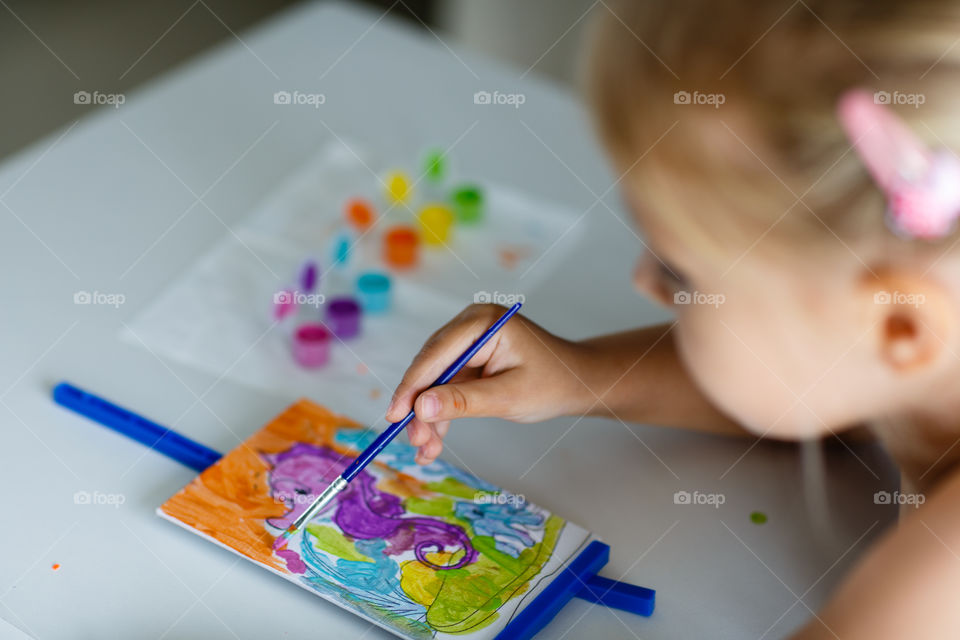 Kid painting at home 