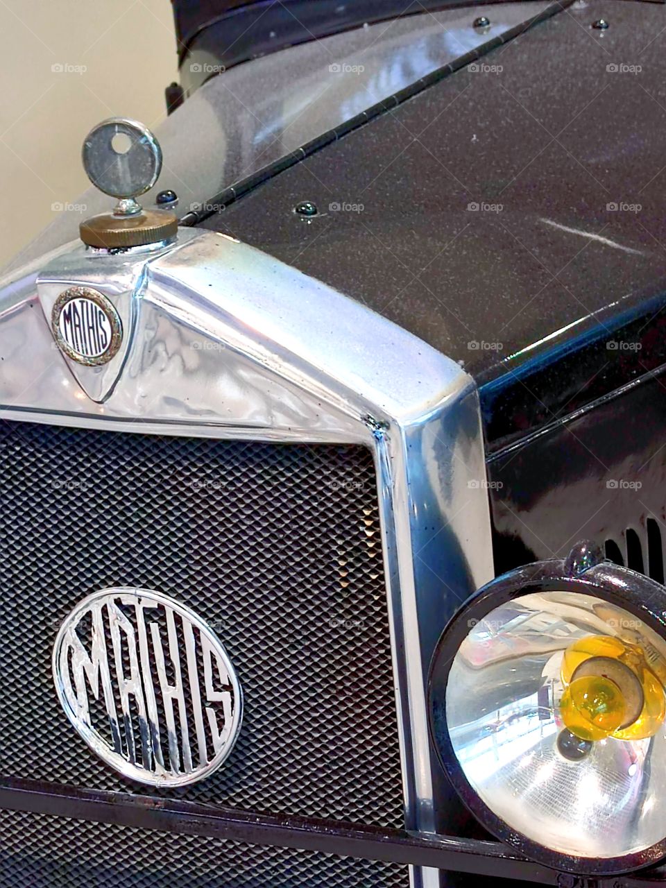 Retro cars.  black car.  "Mathis Type MY". France. 1927.  Front part of the body with logos and emblem