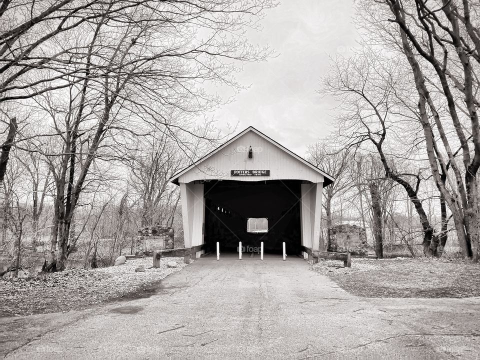 Old covered bridge in Indiana on a winter day in black and white. 