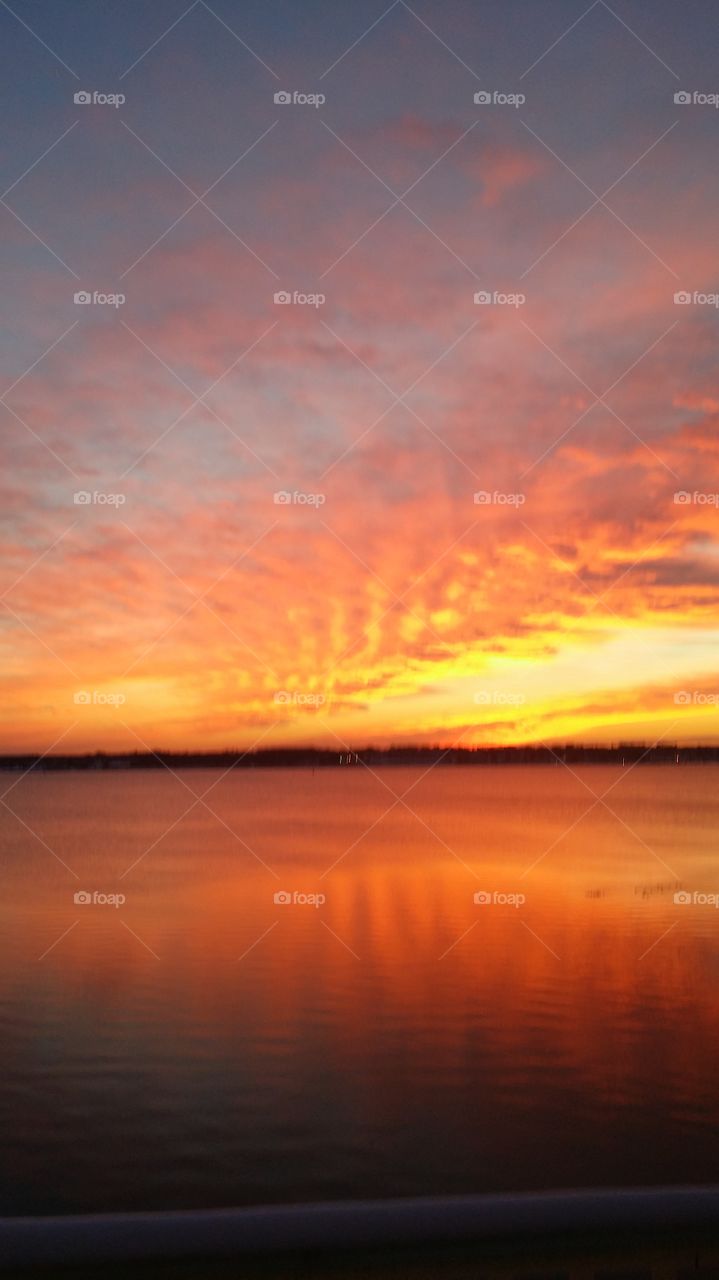 Fire and ice. Narragansett Bay frozen skies on fire and the two collide