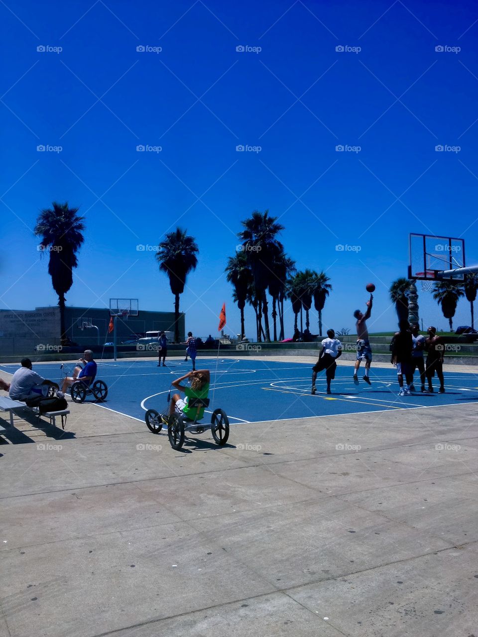 Men play basketball in famous Venice Beach
