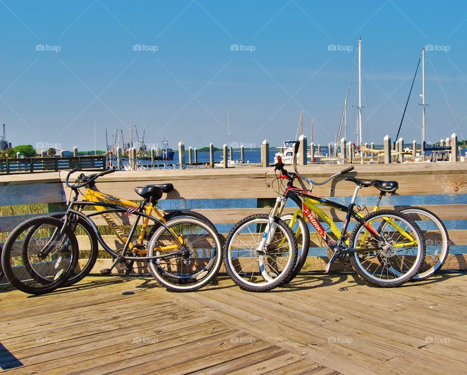 Bicycles on dock by water