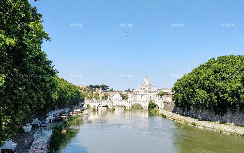 A river view from Rome featuring St. Peter's Basilique