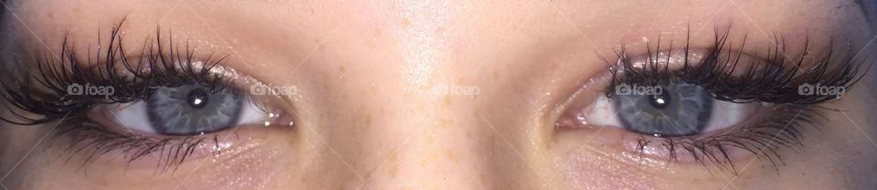 Upclose, beautiful, blue eyes of a natural girl with the cutest freckles! 