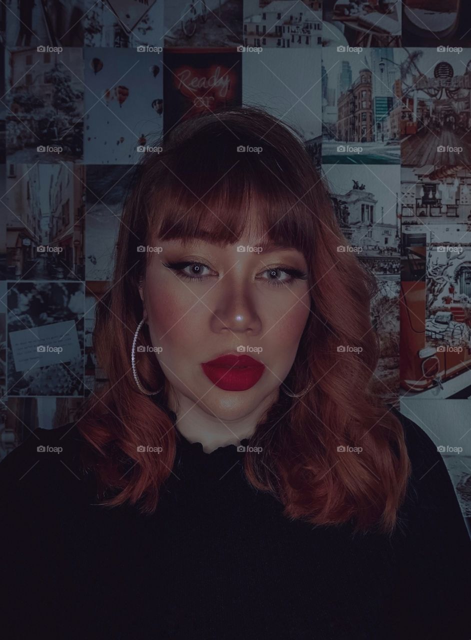 Beautiful woman with red hair and makeup