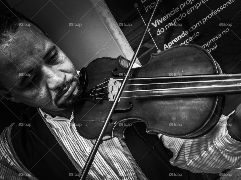 Close-up of african man playing violin