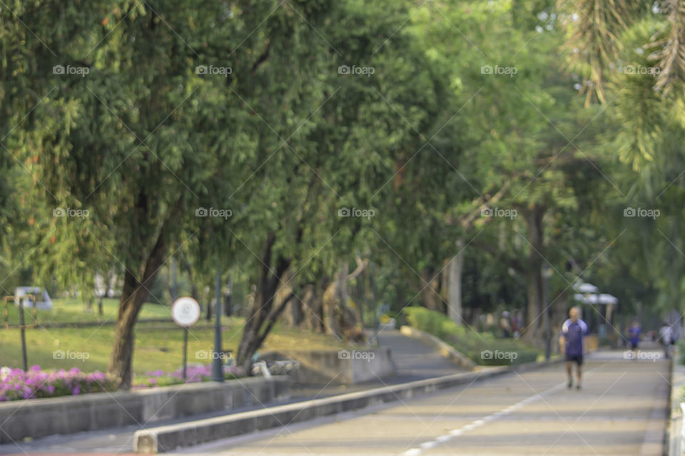 Blurry image people running exercise for health in the Benjakitti Park , Bangkok in Thailand.