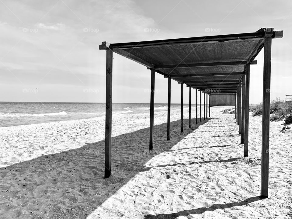 Geometric sunshade at empty beach 