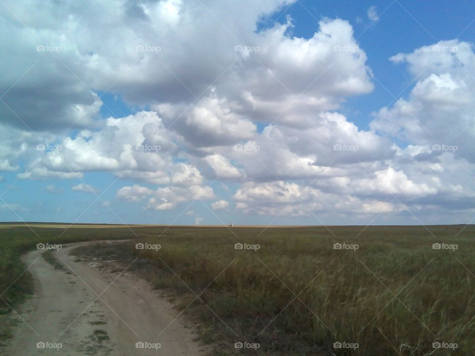 road in steppe and sky