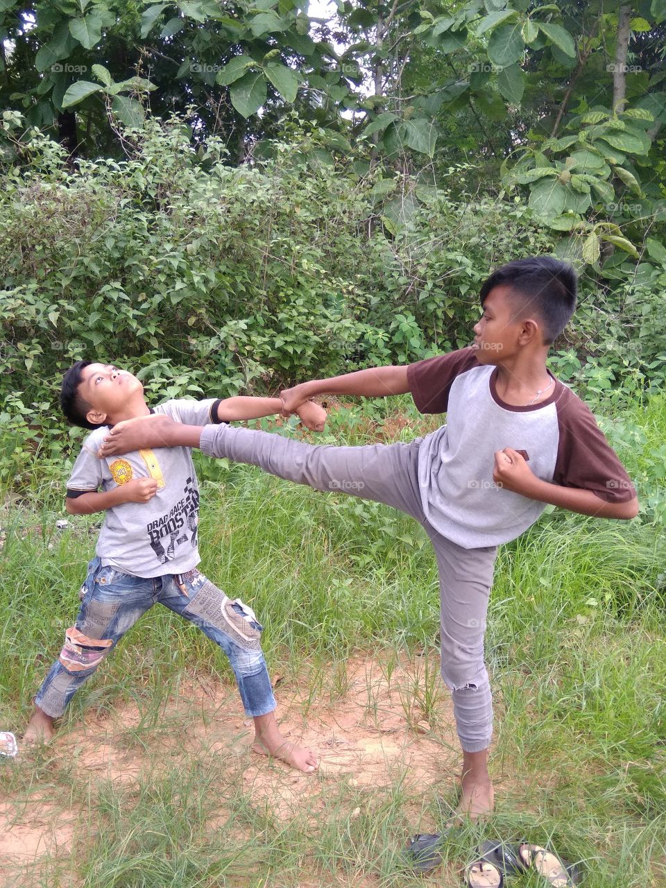 Another village kid acting silat